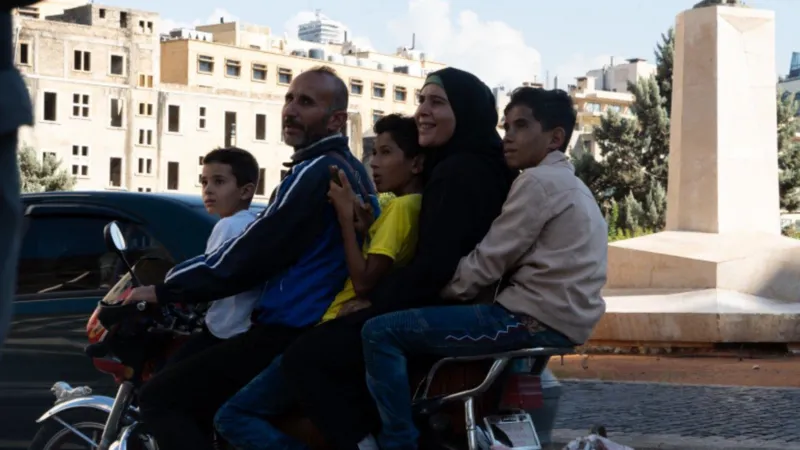 A family of five arrives in Beirut on a motorbike from a southern village/BBC