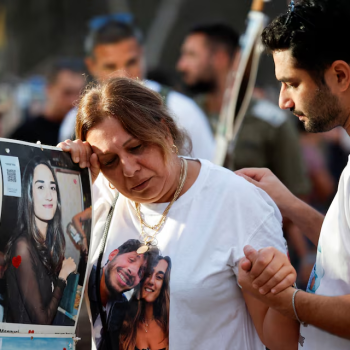 Woman sheds tears during the commemoration of people killed and kidnapped by Hamas on October 7, 2023/Reuters/Amir Cohen