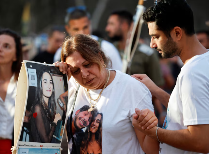 Woman sheds tears during the commemoration of people killed and kidnapped by Hamas on October 7, 2023/Reuters/Amir Cohen