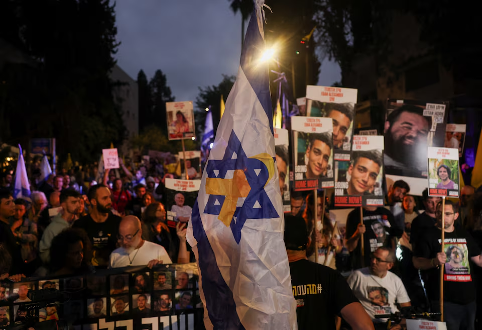 Protesters march towards the private residence of Prime Minister Benjamin Netanyahu during the commemoration/Reuters