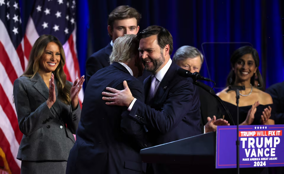 Trump hugs his running mate J.D Vance/Reuters