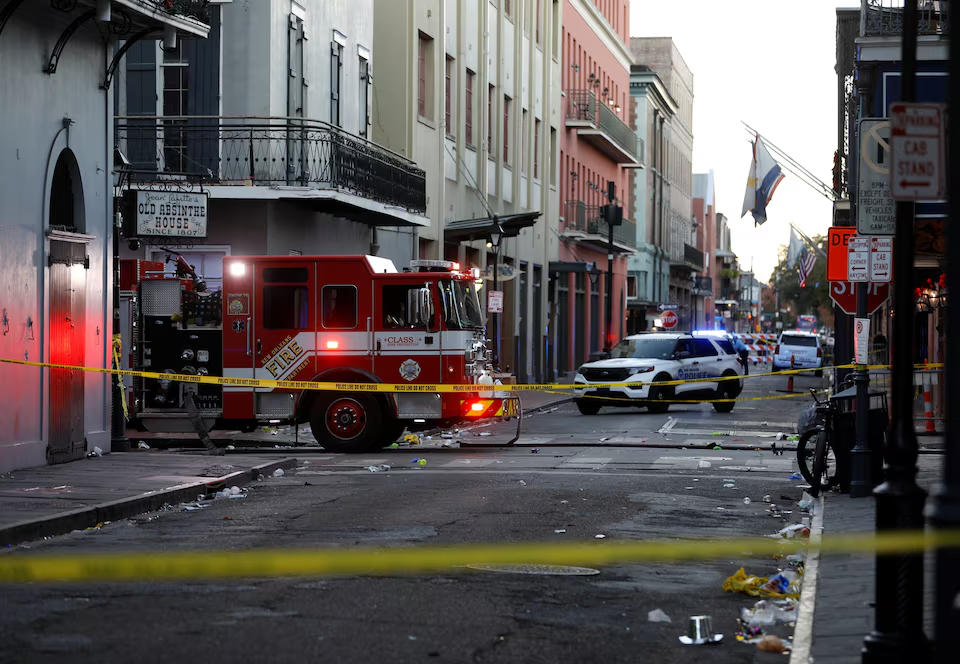 A fire truck and a US police vehicle stationed near the attack site/Reuters