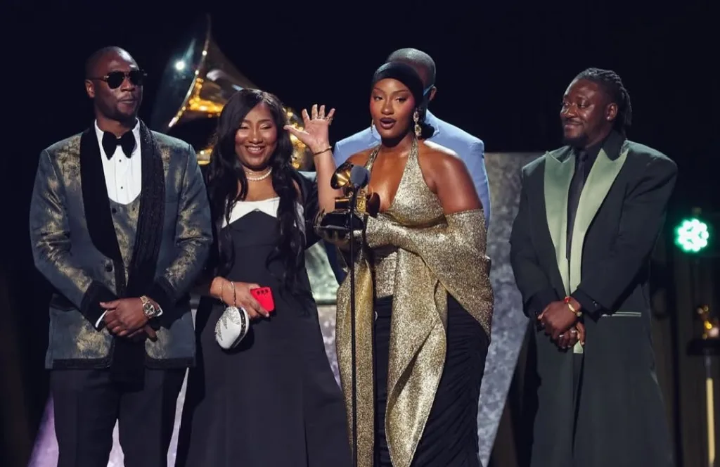 Tems and her team on the 67th Grammys stage/Getty Images