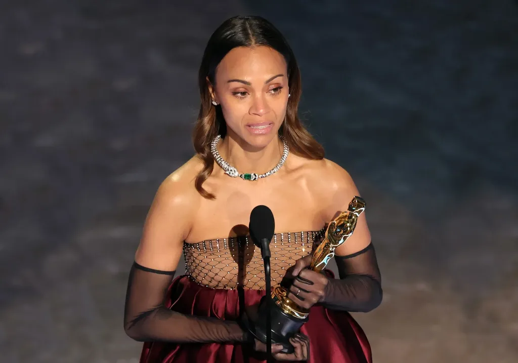 A tearful Zoe Saldaña on the Oscars stage/Vanity Fair